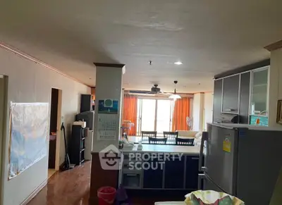 Spacious open-layout kitchen and dining area with modern appliances and ample natural light.