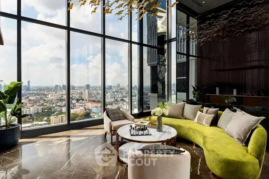 Luxurious living room with panoramic city views and modern decor in high-rise apartment.