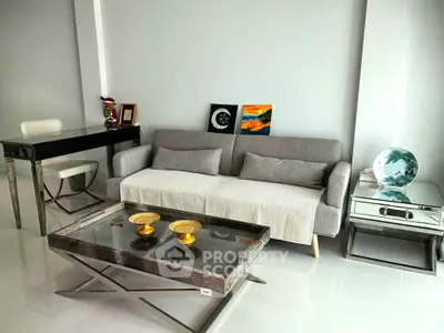 Modern living room with sleek furniture and stylish decor, featuring a comfortable sofa and elegant coffee table.
