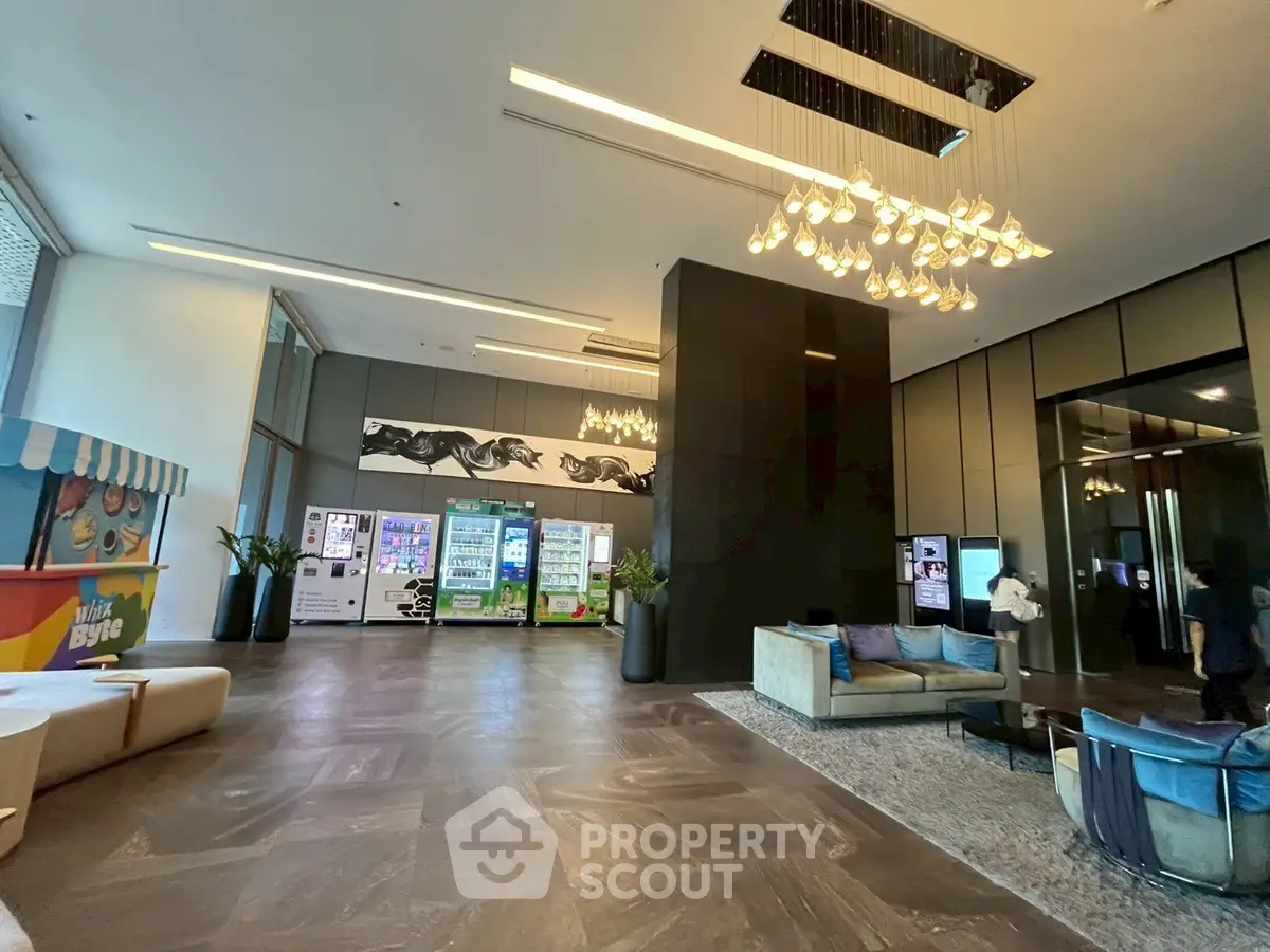 Luxurious lobby with modern decor and vending machines, perfect for upscale living.