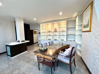 Spacious living room with elegant furniture and built-in shelves, perfect for modern living.