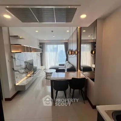 Modern living room with elegant marble accents and stylish lighting