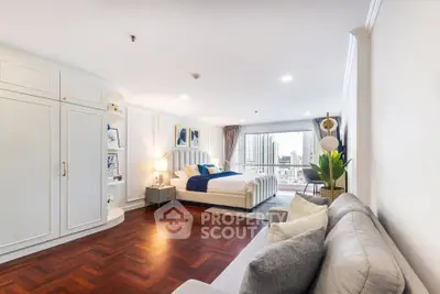 Spacious modern bedroom with city view and elegant decor
