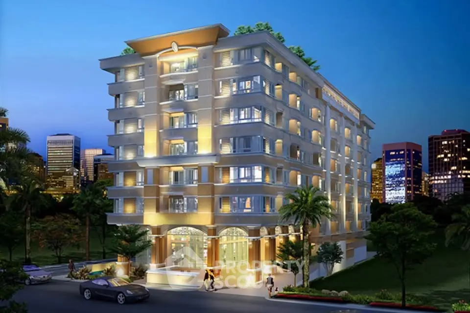Stunning illuminated building exterior with lush surroundings and city skyline view.