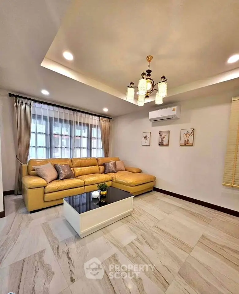 Elegant living room with modern decor and cozy yellow sofa