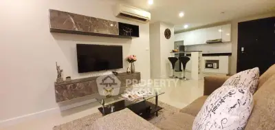 Modern living room with stylish decor and open kitchen layout in a contemporary apartment.