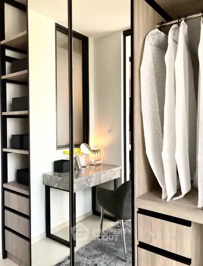 Modern bedroom with stylish vanity and ample closet space