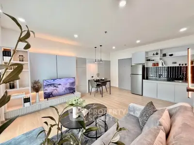 Modern open-plan living room with sleek kitchen and stylish decor