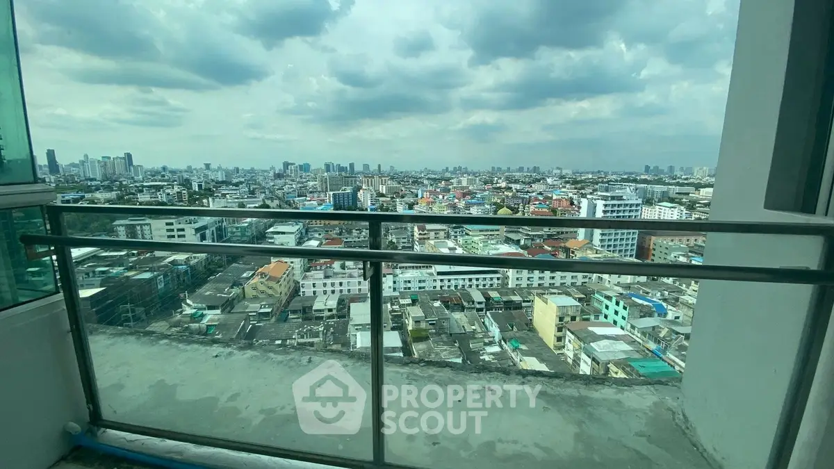 Stunning cityscape view from high-rise balcony with expansive skyline.