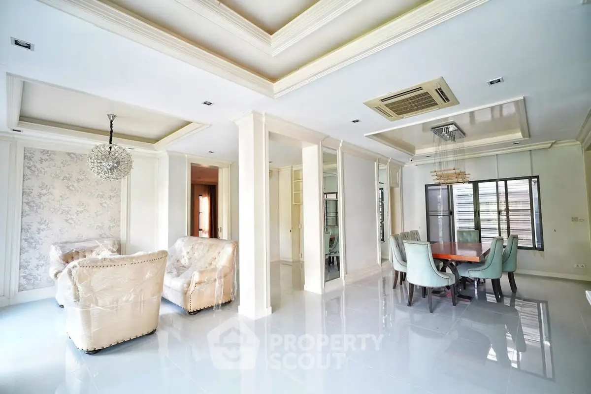 Spacious living room with elegant dining area and luxurious furnishings