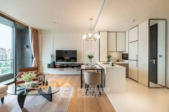 Luxurious modern living room with open kitchen and elegant decor in high-rise apartment.