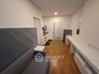 Modern studio apartment with open layout and sleek wooden flooring