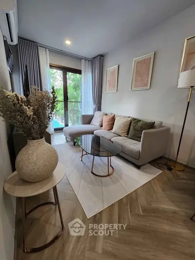 Stylish living room with modern decor and large window view