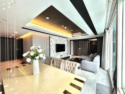 Luxurious modern living room with elegant decor and spacious seating area, perfect for relaxation and entertainment.