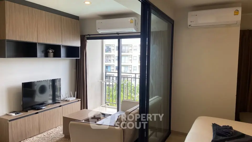 Modern living room with balcony view and air conditioning