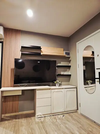 Modern study room with sleek desk, shelves, and wall-mounted TV