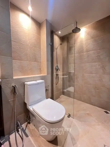 Modern bathroom with glass shower and sleek fixtures