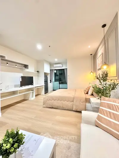 Modern studio apartment with cozy bedroom and stylish decor