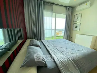 Luxurious bedroom with modern decor and balcony access, featuring stylish bedding and elegant wall art.