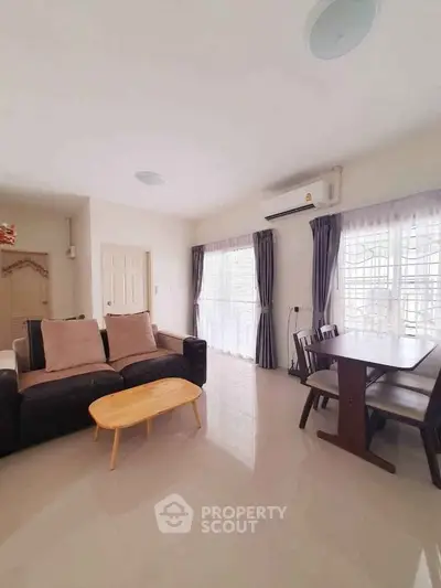 Spacious living room with modern furniture and natural light