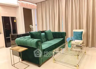 Luxurious living room with elegant green sofa and modern glass coffee table