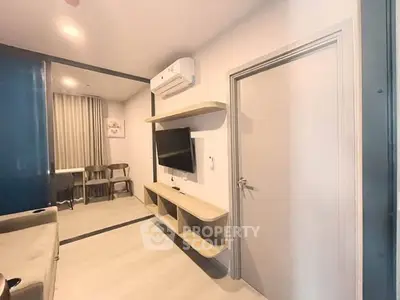 Modern living room with sleek design and wall-mounted TV