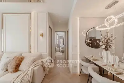 Luxurious modern living room with elegant dining area, plush seating, and chic lighting fixtures.