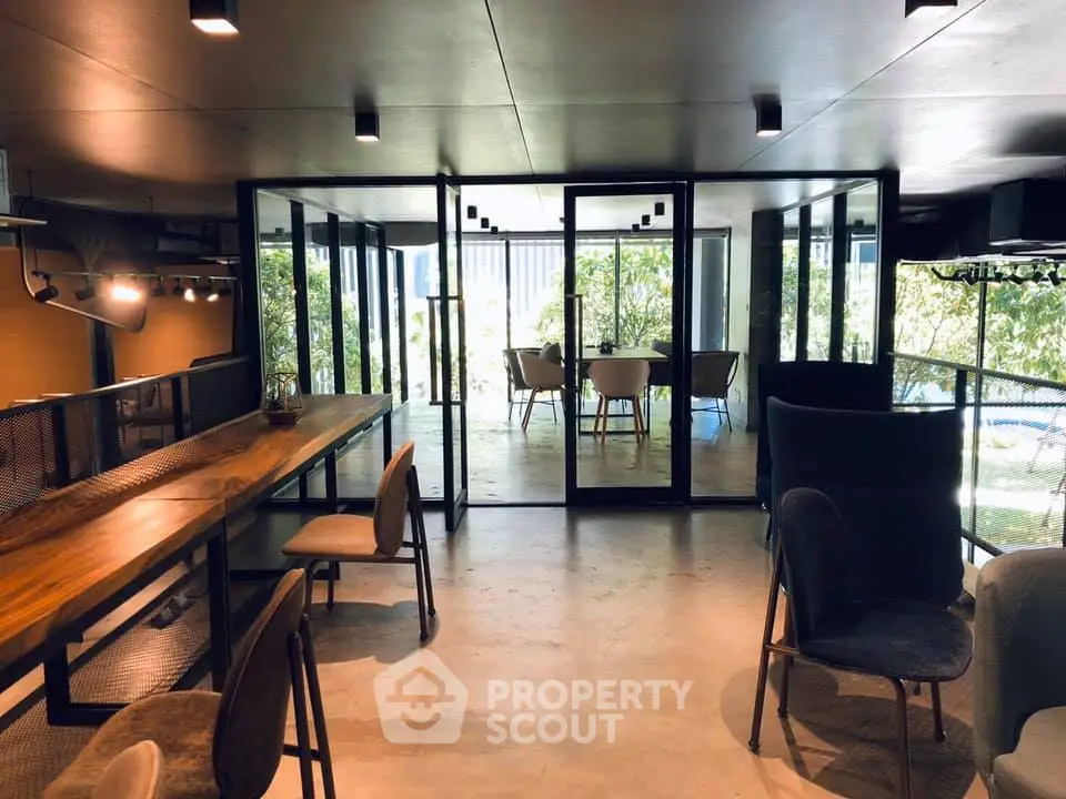 Modern co-working space with glass partitions and stylish furniture