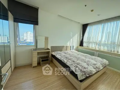 Bright and spacious bedroom with city view and modern furnishings