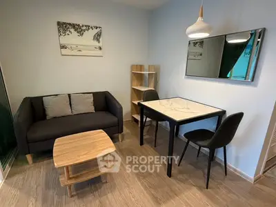 Modern living room with stylish furniture and elegant decor in a cozy apartment setting.