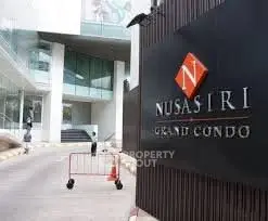Elegant entrance of Nusasiri Grand Condo showcasing modern architecture.
