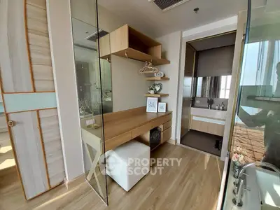 Modern bedroom with stylish vanity and ensuite bathroom in luxury apartment