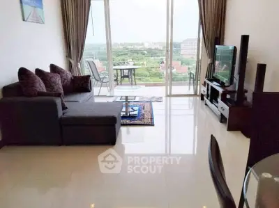 Spacious living room with modern furniture and balcony view