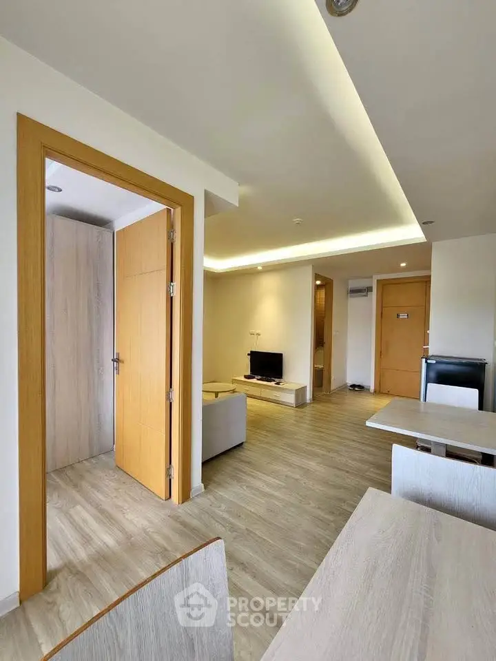 Modern living room with wooden flooring and minimalist furniture