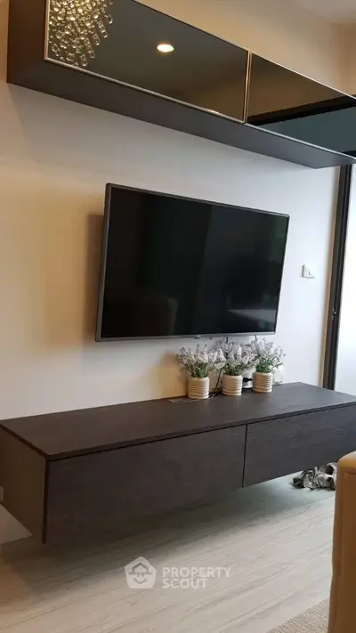 Modern living room with sleek TV setup and elegant decor