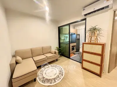 Cozy living room with modern decor and open kitchen layout