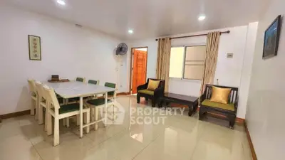 Spacious living room with dining area and elegant decor