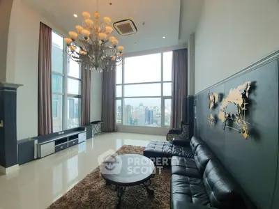 Luxurious high-rise living room with stunning city views and elegant chandelier.