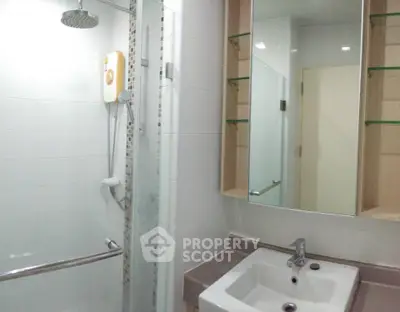 Modern bathroom with shower and sleek sink design