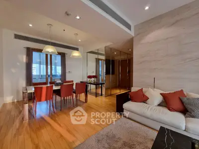 Spacious modern living room with elegant dining area and cozy seating.