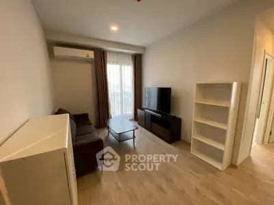 Modern living room with sleek furniture and natural light, perfect for urban living.