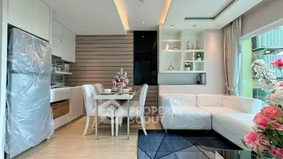 Modern living room with elegant dining area and stylish decor in a contemporary apartment.