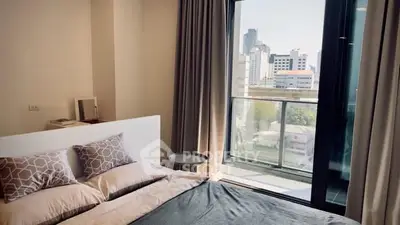 Modern bedroom with balcony view in urban apartment