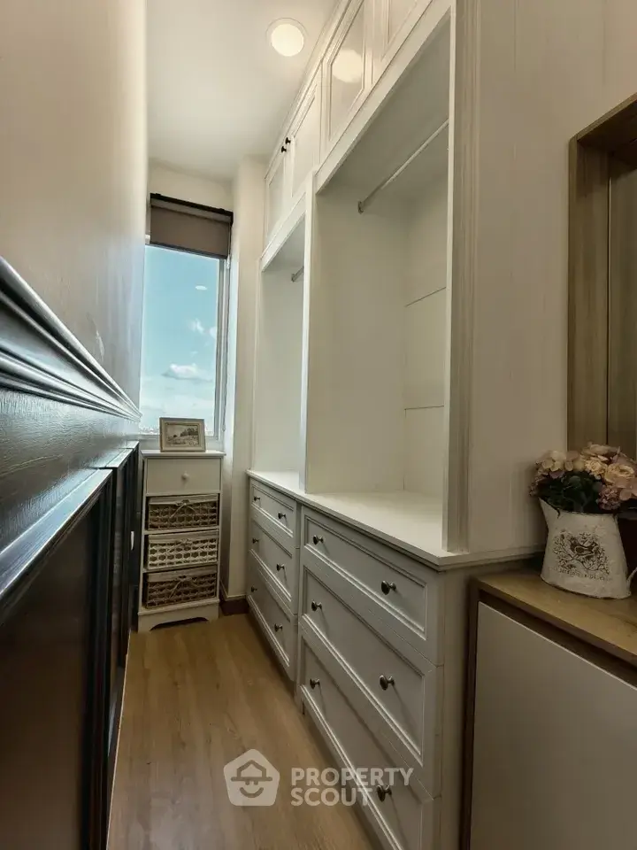 Spacious walk-in closet with ample storage and natural light