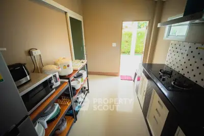 Modern kitchen with gas stove and ample storage space