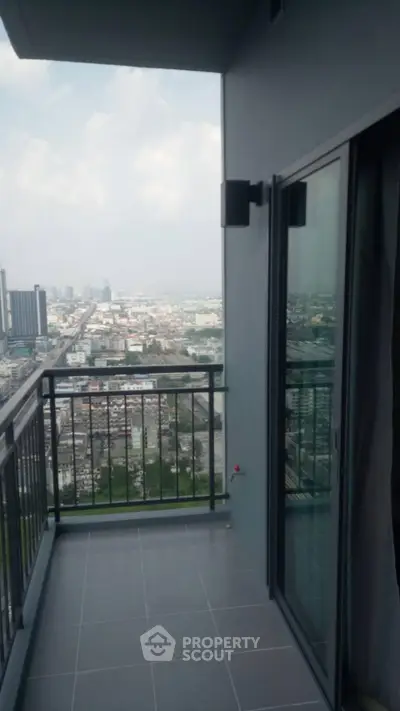 Spacious balcony with stunning city view in modern high-rise apartment