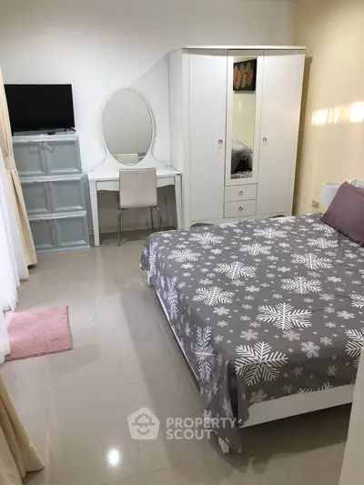 Cozy bedroom with stylish decor and modern furniture, perfect for relaxation.