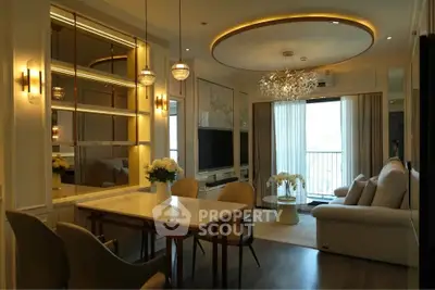 Luxurious living room with elegant lighting and modern decor, featuring a cozy seating area and dining space.