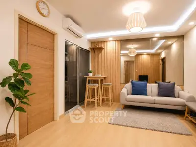 Modern living room with stylish decor, cozy sofa, and wooden accents for a warm ambiance.
