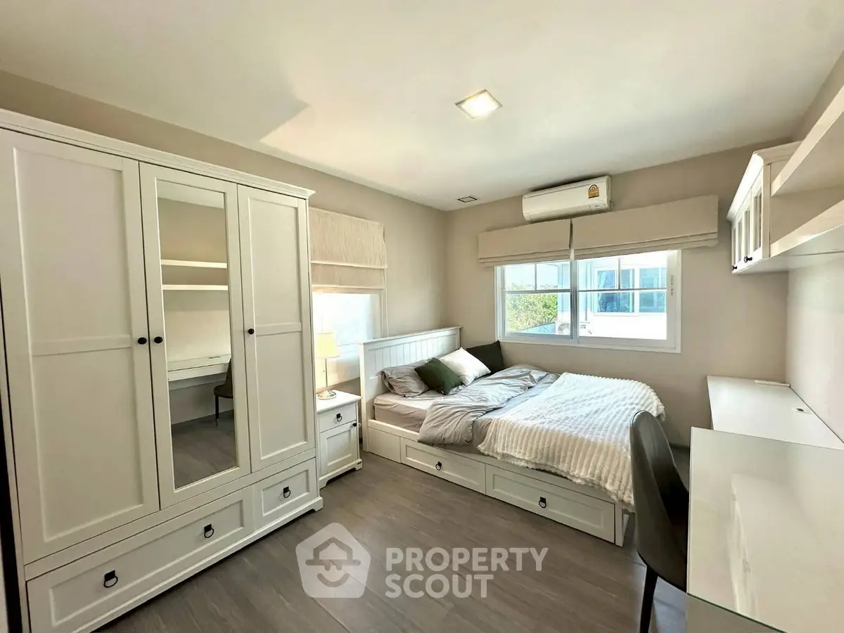 Cozy bedroom with modern furniture and natural light